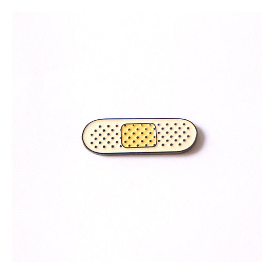 Small bandaid with dotted texture.