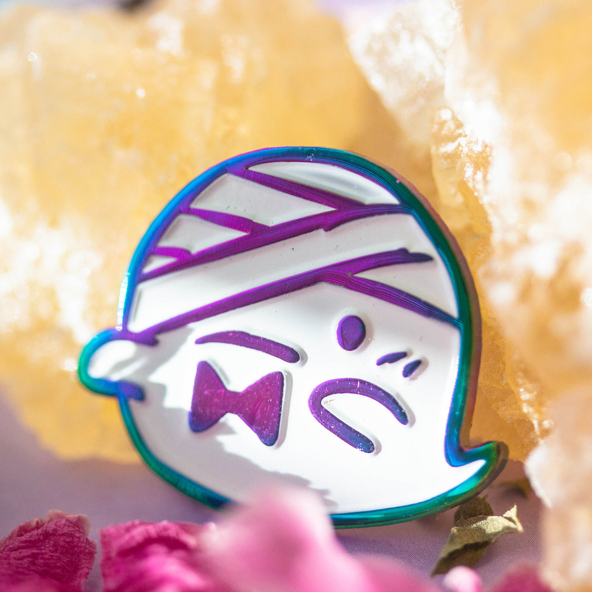 Iridescent ghost with bandaged head and bowtie.