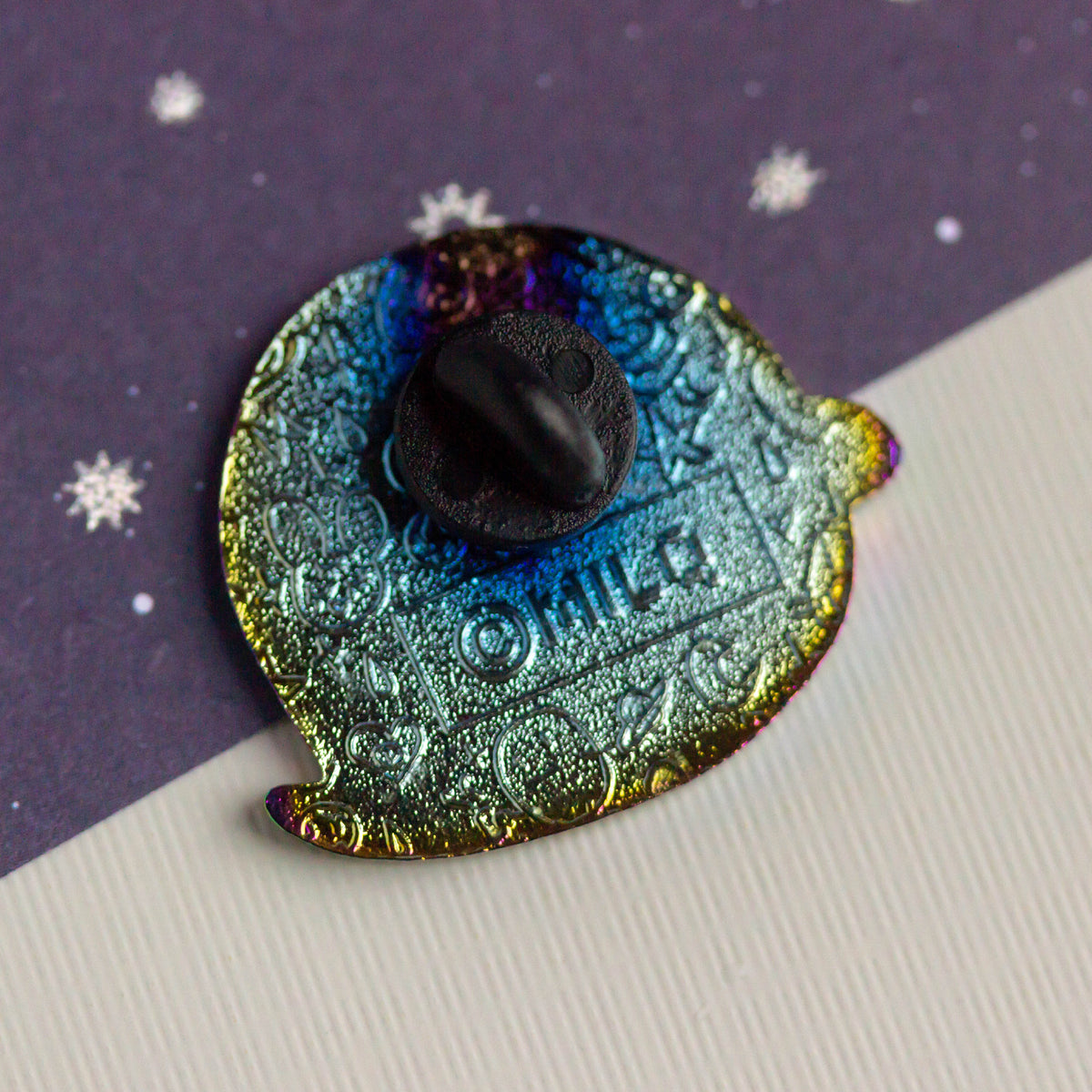 Iridescent ghost with bandaged head and bowtie.