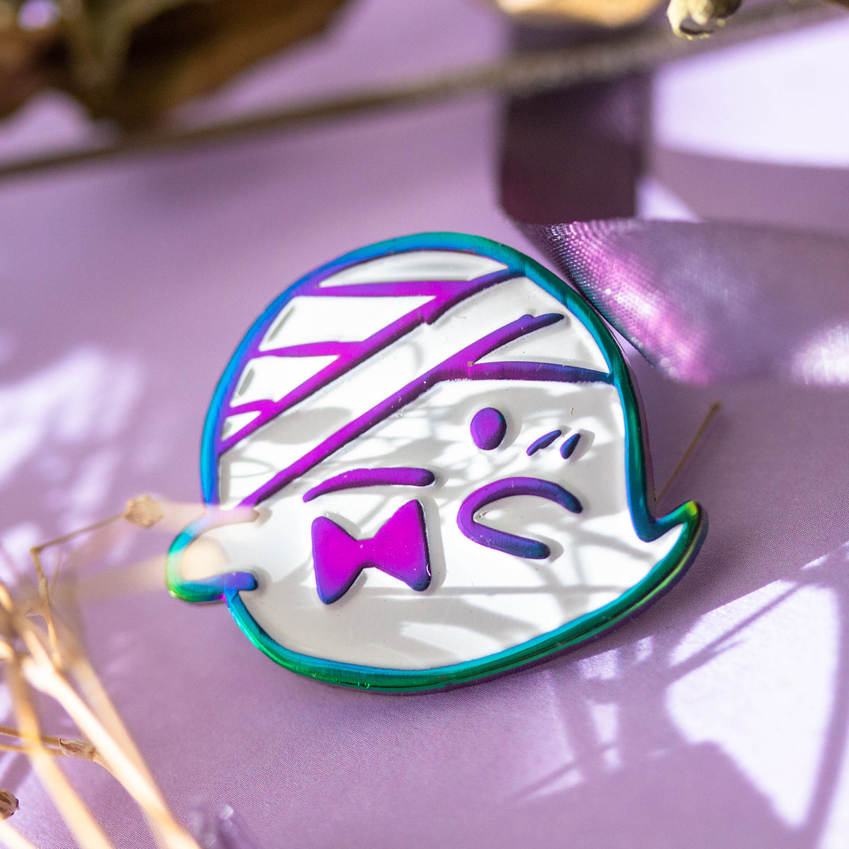 Iridescent ghost with bandaged head and bowtie.
