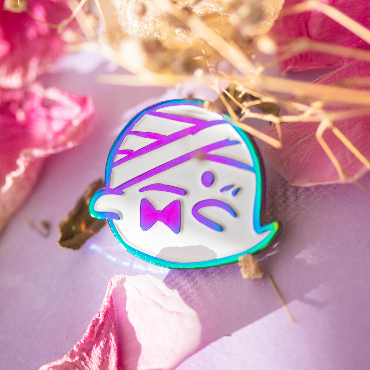 Iridescent ghost with bandaged head and bowtie.