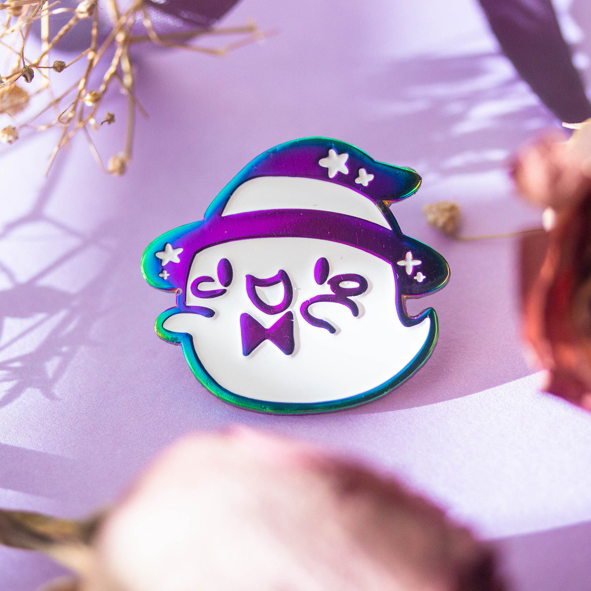 Iridescent ghost with witch hat and bowtie.
