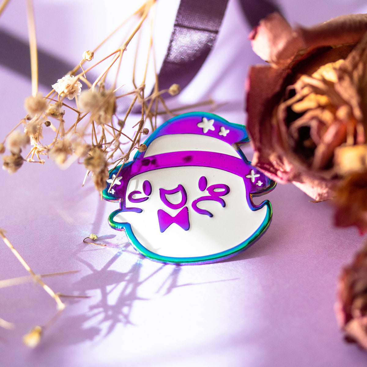 Iridescent ghost with witch hat and bowtie.