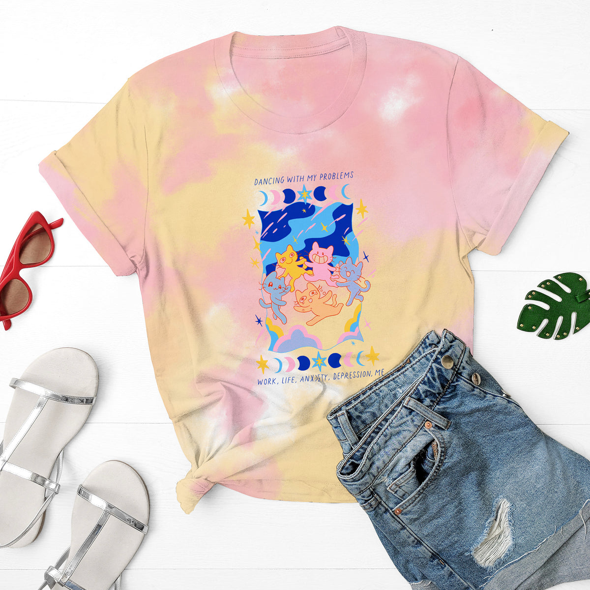 Pink-orange tie dye shirt with dancing cats and "dancing with my problems: work, life, anxiety, depression" written.